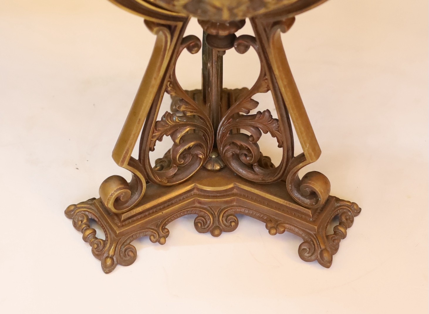 A Victorian bronze Renaissance revival oil lamp, decorated with masks and scrolls, with duplex mechanism, frosted glass shade and flue, height overall 58cm